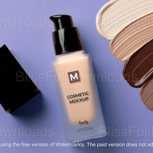 May include: A cosmetic mockup with a beige foundation bottle and a black cap on a purple background. Swatches of various foundation shades are displayed. The bottle has the text "COSMETIC MOCKUP" and the letter "M".