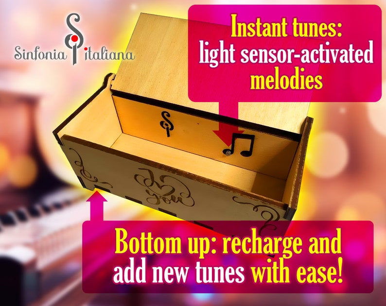 May include: A wooden music box with a light sensor that plays melodies when exposed to light. The box is open, revealing a small music note button and the words "Sinfonia Italiana" on the lid. The text "Instant tunes: light sensor-activated melodies" is written in a pink box above the music box. The text "Bottom up: recharge and add new tunes with ease!" is written in a pink box below the music box.