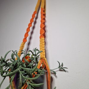 Yellow and orange macramé plant holder