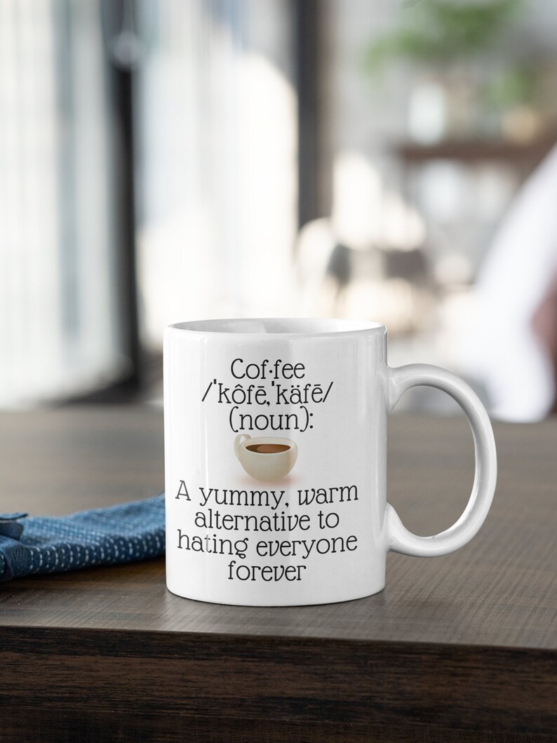May include: White ceramic coffee mug with the word "Coffee" and its pronunciation, along with the definition "(noun): A yummy, warm alternative to hating everyone forever."