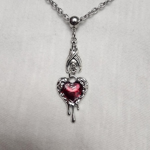 Bleeding heart bat necklace