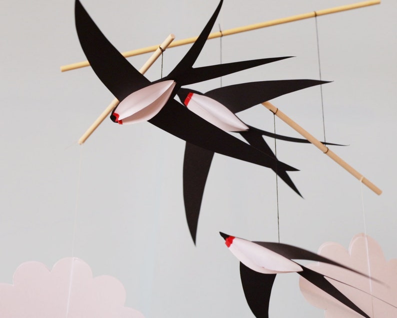DIY Montessori mobile with black and white animal shapes hanging