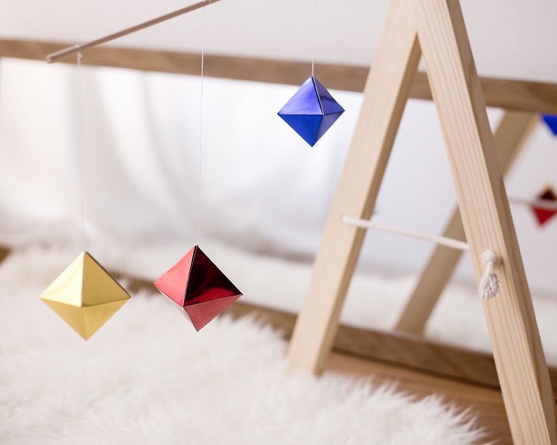 The DIY Montessori Octahedron baby mobile on a mobile stand