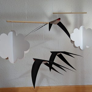 The DIY Montessori Swallows Mobile in front of a white background.