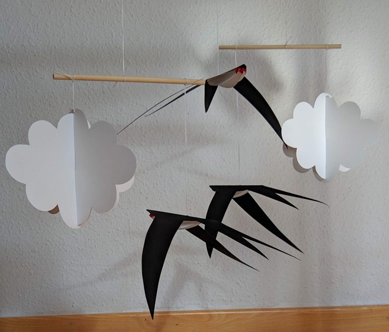 The DIY Montessori Swallows Mobile in front of a white background.