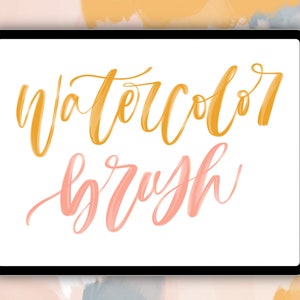 May include: A digital tablet screen displaying the text "watercolor brush" in a stylized font. The text is in shades of yellow and pink.