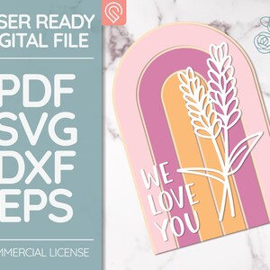 May include: A digital file for laser cutting a card with a rainbow arch and the text "We Love You" in white. The card also features a white floral design.