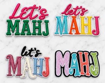 May include: Four embroidered patches featuring the text Let's MAHJ. The top left patch has pink and green lettering. The top right patch features multi-colored letters. The bottom left patch has black, pink, cream, blue, and red letters. The bottom right patch has multi-colored letters with a black outline.