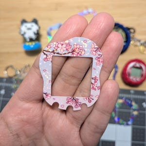 Carátulas para Tamagotchi Uni: flores, estrellas, gatos. 80s, hello kitty. Acabado holográfico