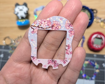 Tamagotchi Uni Faceplates: Flowers, stars, cats, 80's. Holographic finish. Hand-drawn custom accessories for Tamagotchi collectors.