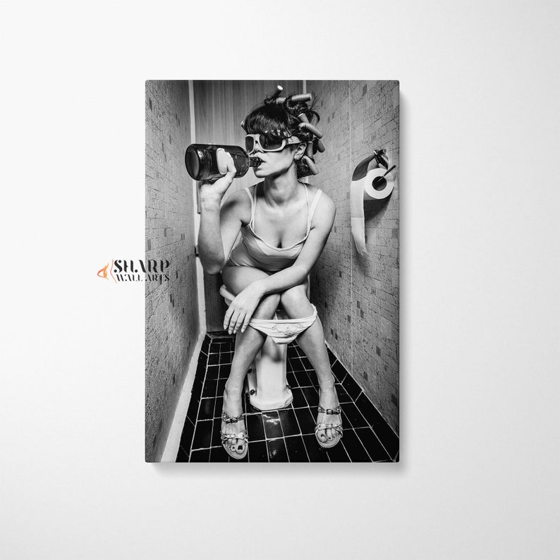 May include: Black and white photo of a person sitting on a toilet in a bathroom, drinking from a bottle. The person is wearing sunglasses and has their hair in rollers.