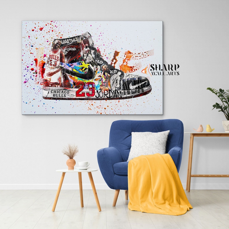 May include: A colorful abstract painting of a basketball shoe with a white background. The shoe is a high-top with a red and black color scheme. The number "23" and the words "Chicago Bulls" and "Jordan" are visible on the shoe. The painting is splattered with paint in various colors.