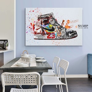 May include: A white canvas print with a colorful abstract design featuring a basketball shoe with the number 23 and the words "Chicago Bulls" and "Jordan". The design includes splashes of color and a basketball player in the background.
