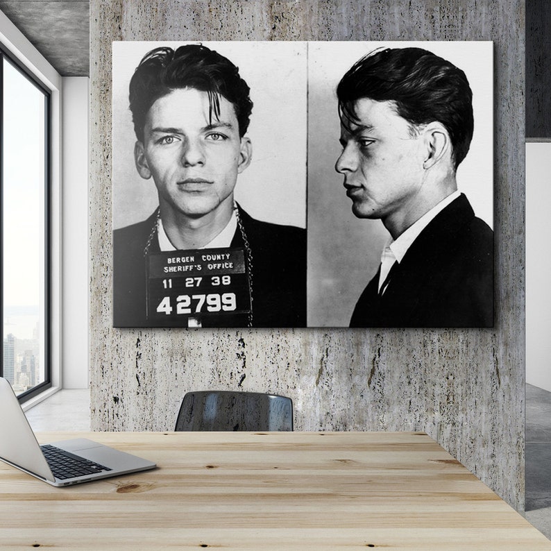 May include: Black and white mugshot of a man with short dark hair. The mugshot is from the Bergen County Sheriff's Office and the man's ID number is 42799.