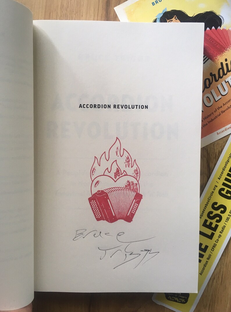 The signed opening page of my book with a flaming heart Accordion rubber stamped on it.