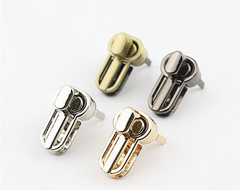 Bag hardware accessories: straight bar lock, oval-shaped toggle lock, twist lock buckle. Hardware accessories locks for bags and clothing