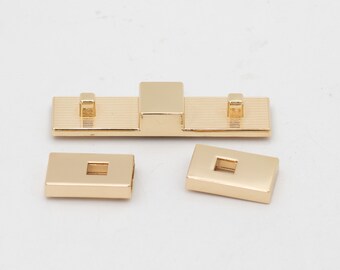 latest zinc alloy hardware accessories for handbags and luggage: rectangular magnetic lock, female bag hardware long bar lock with magnet