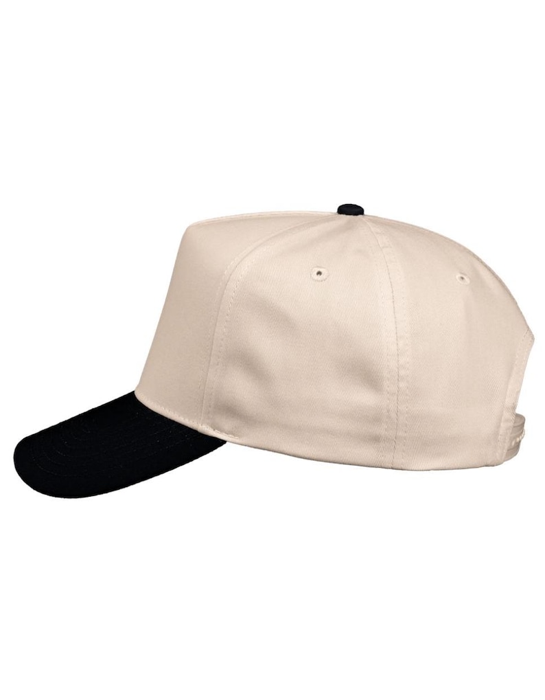 May include: A baseball cap with a cream-colored crown and a black brim. The cap has a structured design with a curved brim and a button on top. The hat is a classic accessory.