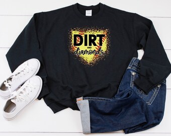 May include: Black sweatshirt with a yellow and red softball graphic and the text "Dirt and Diamonds".