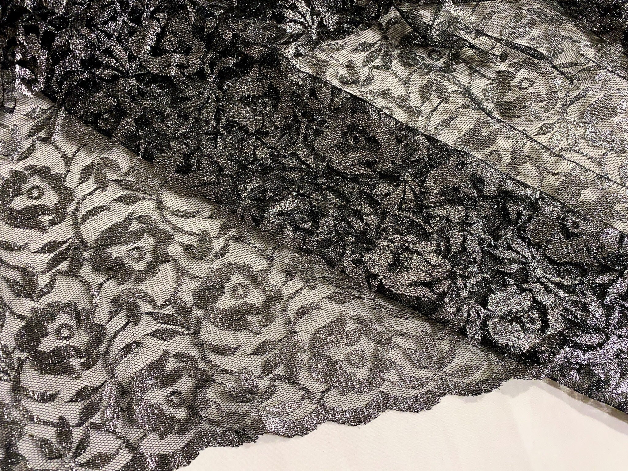 Black and 2024 silver lace fabric