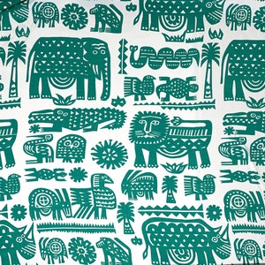 May include: White fabric with a repeating pattern of green stylized animals and plants. The design includes elephants, lions, crocodiles, birds, and palm trees. The overall aesthetic is reminiscent of a vintage safari theme.