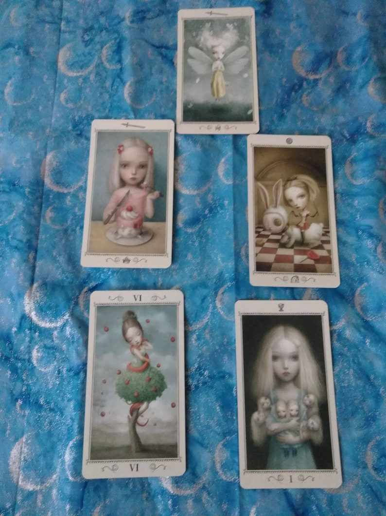 May include: A set of ten tarot cards featuring illustrations of fairies and other whimsical characters. The cards are in a vintage style with a white background and black borders. The cards are numbered with Roman numerals.