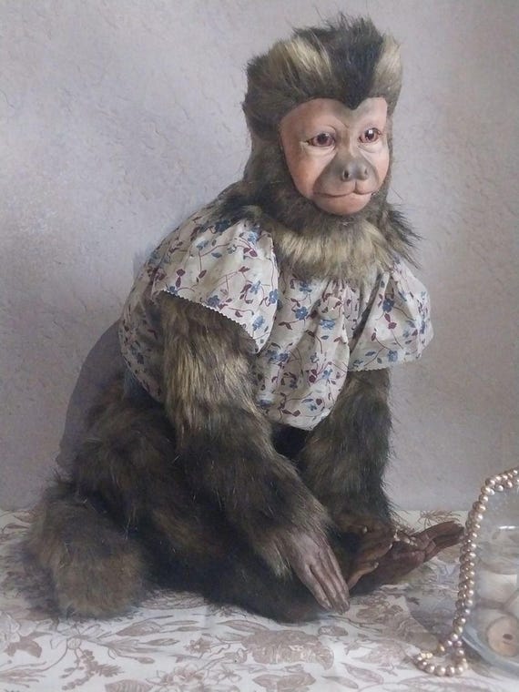 a monkey dressed in silk is still a monkey A funny monkey sitting in a vintage barber chair, wearing a red silk dress, long messy hair being straightened, peaceful expression, #usa