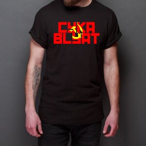 May include: A black t-shirt with a red and yellow hammer and sickle symbol and the text "CYKA BLYAT" in red letters.