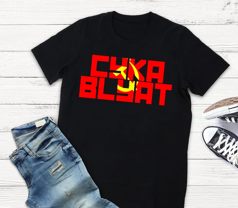 May include: Black t-shirt with a red and yellow graphic that says "CYKA BLYAT".