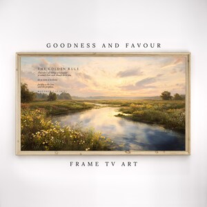 May include: A rectangular landscape wall art piece in a light wood frame featuring a serene river scene at sunset with yellow wildflowers in the foreground. The text reads: THE GOLDEN RULE, Therefore all things whatsoever ye would that men should do to you, do ye even so to them: for this is the Law and the prophets. MATTHEW 7:12 (KJV).