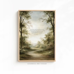 May include: A vertical rectangular wall art print in a light wood frame featuring a forest landscape with a central path. The image includes the text: Trust in the LORD with all thine heart; and lean not unto thine own understanding. In all thy ways acknowledge Him, and He shall direct thy paths. PROVERBS 3:5-6.
