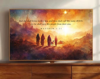 May include: A rectangular wall art print featuring a watercolor-style landscape with four figures and a donkey walking toward a glowing horizon. The text reads: And she shall bring forth a Son, and thou shalt call His name JESUS: for he shall save His people from their sins. MATTHEW 1:21.