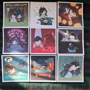 May include: A set of nine illustrated cards featuring cartoon characters in various poses and settings. The cards are printed on white cardstock and have a glossy finish. The characters are all dressed in traditional Chinese clothing and are set against a variety of backgrounds, including a garden, a moonlit night, and a room with lanterns. The cards are perfect for fans of Chinese animation and culture.