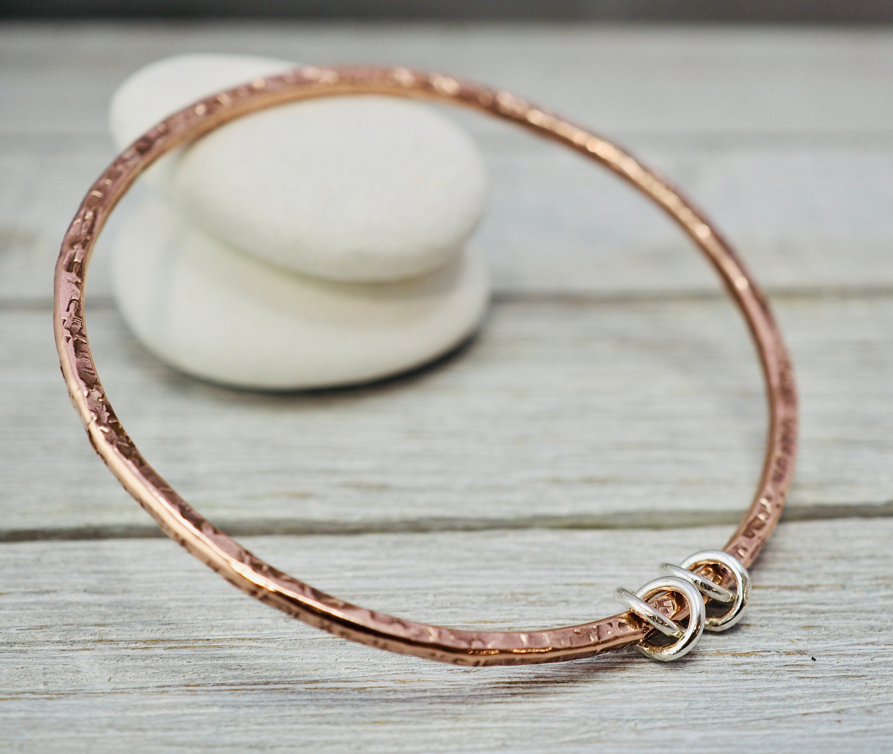 Copper bangle with sterling silver detail Hammered copper bangle with