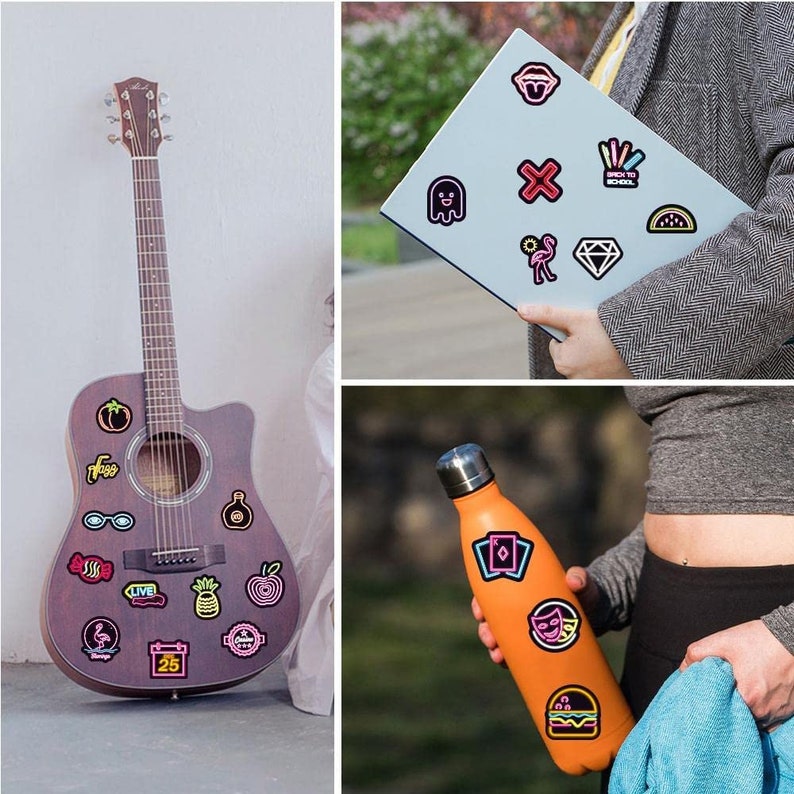 May include: A brown acoustic guitar with various colorful stickers on the body, including a pineapple, a watermelon, a pair of sunglasses, a tomato, a candy cane, a bottle, a calendar, a heart, and the word "LIVE".