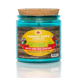 May include: A teal blue glass jar candle with a cork lid. The label is yellow with a red border and features a parrot and the text "PARROT Safe CANDLES", "THE LIGHTER WAY TO ENJOY SCENTS", "WHITE sage and LAVENDER", "VETERINARIAN APPROVED", "ODOR ELIMINATOR", "SAFEST CANDLES FOR ALL ANIMALS + HUMANS", "100% SOY WAX", "13 OZ (369 G)", and "WWW.PARROTSAFECANDLES.COM".