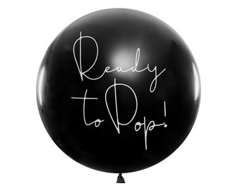 May include: A black balloon with the text "Ready to Pop!" written in white.