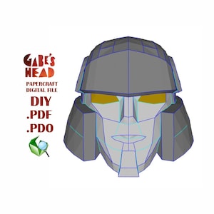 Op de afbeelding: Een grijs papieren model van Megatrons hoofd uit de Transformers-franchise. Het model is in 3D-stijl en heeft gele ogen. De tekst "Gabe's Head" staat in de linkerbovenhoek van de afbeelding. De tekst "Papercraft Digital File" staat onder de titel. De tekst "DIY .PDF .PDO" staat onder het bestandstype.