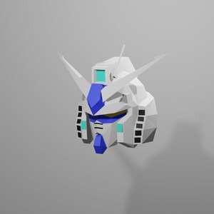 Puede incluir: Una cabeza de robot de origami blanca y azul con una visera azul y antenas blancas.