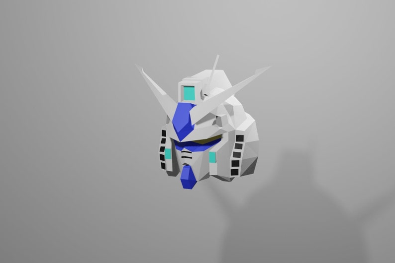 Puede incluir: Una cabeza de robot de origami blanca y azul con una visera azul y antenas blancas.