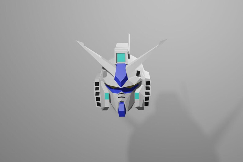 Puede incluir: Una cabeza de robot blanca y azul con un casco puntiagudo y una visera azul. La cabeza del robot est&aacute; sobre un fondo blanco.