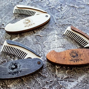 May include: Three wooden pocket combs with a wolf logo and the text "HuskY." The combs are closed and have a wood grain pattern.