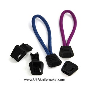 May include: Four black plastic cord locks with two blue and two purple paracord loops. The cord locks are used for securing cords and straps.