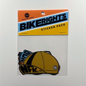 May include: A sticker pack with the words "Bikerights" in black text on a yellow and blue background. The pack includes a sticker of a yellow and black bicycle helmet with the words "NFKVA" in black text.