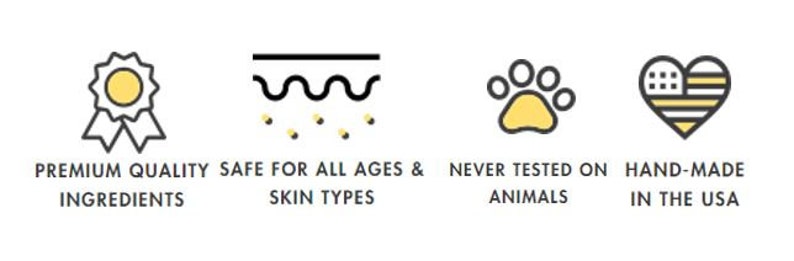 May include: Four icons representing product features: a gold award ribbon, a wavy line with dots representing skin, a paw print, and a heart with stars and stripes. Text below the icons reads: "Premium Quality Ingredients", "Safe for All Ages & Skin Types", "Never Tested on Animals", and "Hand-Made in the USA".