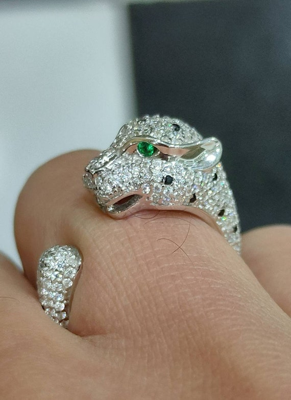Cartier Panthère diamonds, emeralds, onyx and gold ring