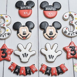 One dozen Mickey Mouse birthday cookies with number cookies and banner cookies