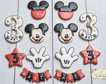 One dozen Mickey Mouse birthday cookies with number cookies and banner cookies