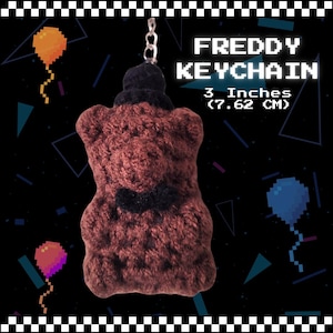 May include: Brown plush Freddy Fazbear keychain with a black top hat and bow tie. The keychain is 3 inches (7.62 cm) tall.