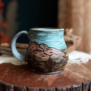 Big blue skies desert mug. 18 ounce, hand painted and carved. Handmade mug.